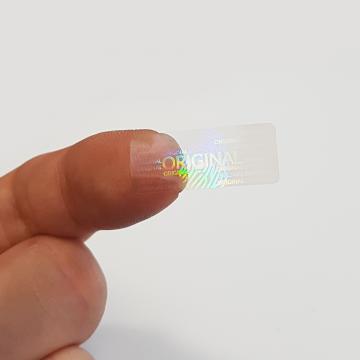 Transparentní hologramová samolepka original s motivem otisku prstu 25x10mm